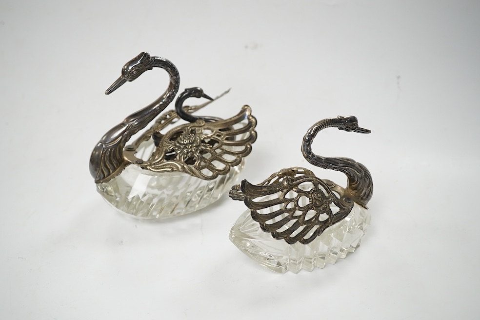 A graduated set of three silver mounted glass swan condiments, London, 1978, largest height 12.9cm. Condition - fair